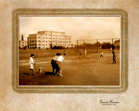 Boys playing baseball with old Sacred Heart Hospital in background